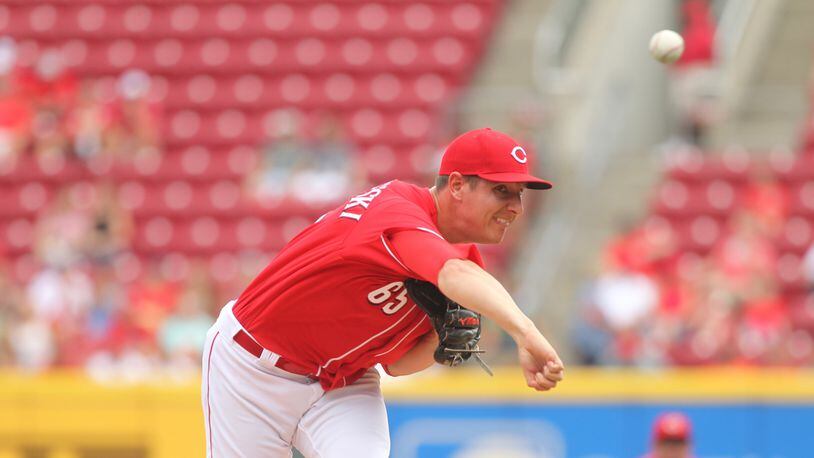 Reds reliever Asher Wojciechowski pitches against the Nationals on Monday, July 17, 2017, at Great American Ball Park in Cincinnati. David Jablonski/Staff