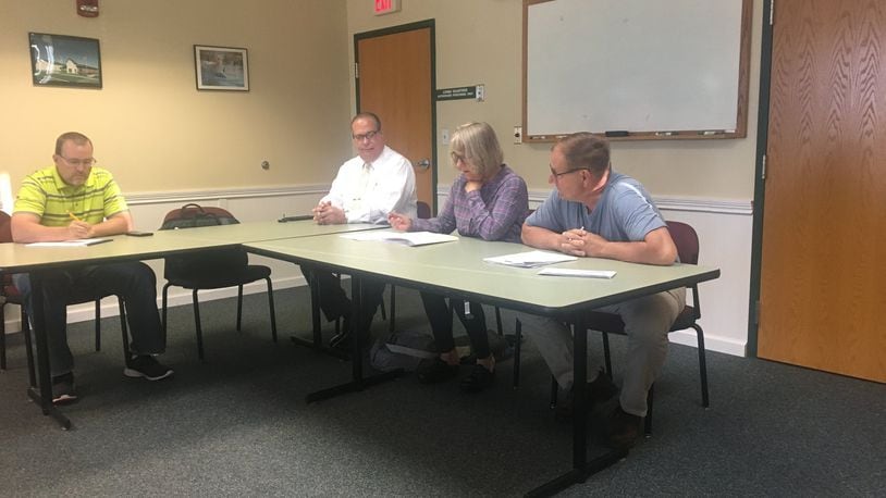Mad River Twp. Trustees voted to hire 12 new employees and give everyone raises Friday during a special meeting at the Mad River Twp. Fire and EMS station.
