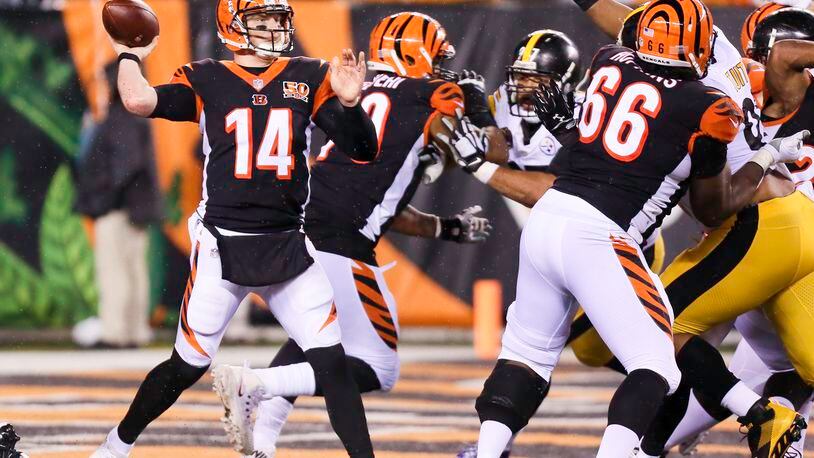 Bengals quarterback Andy Dalton (14) looks for an open receiver during the second half of their 23-20 loss to the Steelers at Paul Brown Stadium, Monday, Dec. 4, 2017. GREG LYNCH / STAFF