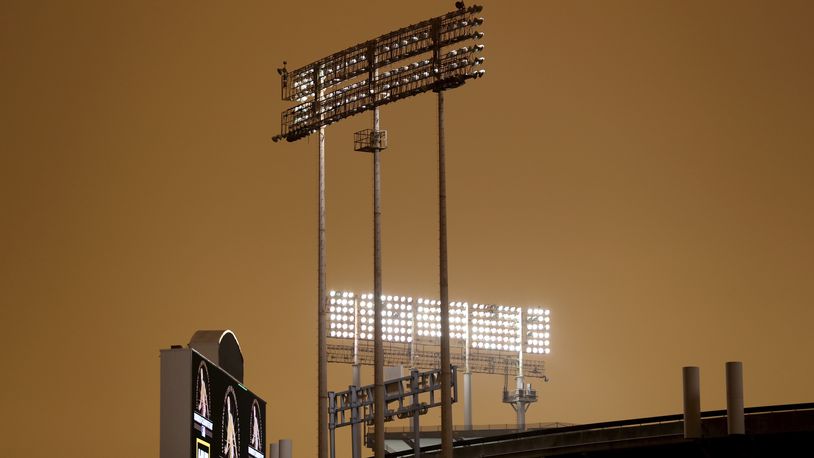 RingCentral Coliseum stands under skies darkened by wildfire smoke before the Oakland Athletics' baseball game against the Houston Astros in Oakland, Calif., Wednesday, Sept. 9, 2020. (AP Photo/Jed Jacobsohn)