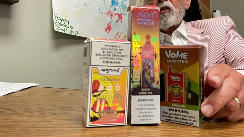 Bruce Barcelo, senior program coordinator with Montgomery County Alcohol, Drug Addiction, and Mental Health Services (ADAMHS) shows the types of flavored e-cigarettes and vapes that are appealing to adolescents and young adults. SAMANTHA WILDOW\STAFF