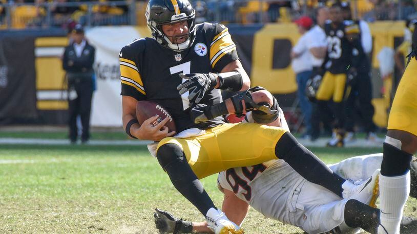 Pittsburgh Steelers quarterback Ben Roethlisberger (7) is sacked by Cincinnati Bengals defensive end Sam Hubbard (94) during the second half an NFL football game, Sunday, Sept. 26, 2021, in Pittsburgh. (AP Photo/Don Wright)