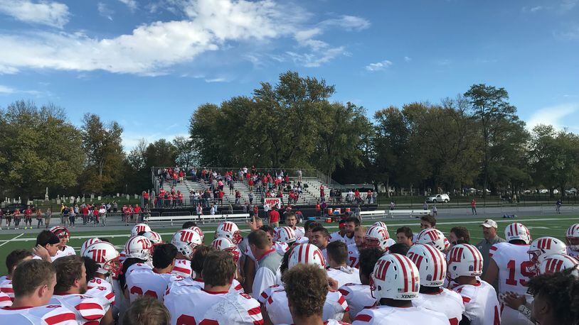 Wittenberg players gather around Joe Fincham after a win at DePauw. Submitted photo