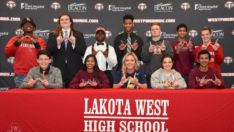 Twelve Lakota West High School student-athletes were included in a Signing Day ceremony at the school last winter. The top row (left to right) includes David Walcott (football, Ball State), Brian Qua (football, Grand Valley State), Zelwyn Robinson (football, Georgetown), Payton Porterfield (football, Hocking College), Brandon Whited (soccer, Heidelberg), Jeffrey Douyere (soccer, Earlham) and Andrew Brengelman (soccer, Malone). The front row (left to right) includes Will Nguyen (football, Georgetown), Jennifer Douyere (soccer, Earlham), Caley Murphy (soccer, Mount St. Joseph), Devin Duhme (soccer, Lander) and Jeremy Douyere (soccer, Earlham). SUBMITTED PHOTO