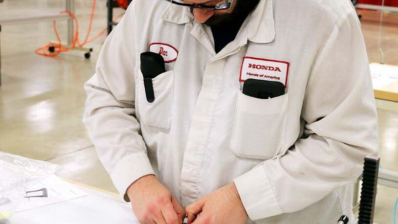A Honda employee in Marysville works on ventilator parts. Honda photo.