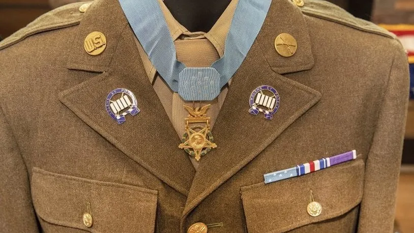 An authentic uniform and Medal of Honor were presented at a ceremony that named a Colorado Springs, Colo., health clinic after World War II Army Pfc. Floyd Lindstrom. Air Force photo by Visual Information Specialist Shawn Fury