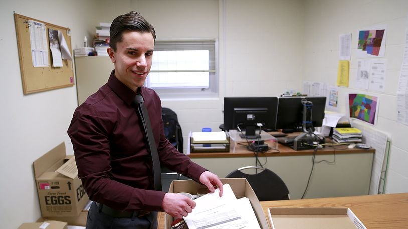 Gabe Jones packs up his office in the Clark County Combined Health District Wednesday. Jones is the new Champaign County Health Commissioner. Bill Lakey/Staff
