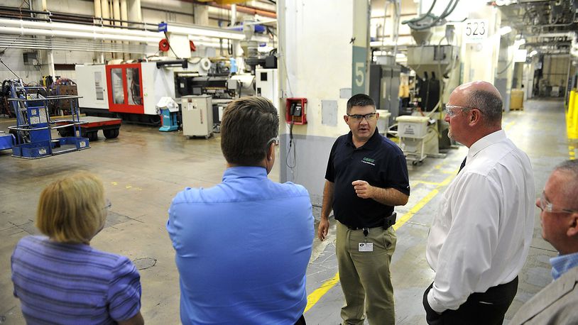 Dan Szklany, plant manager at Orbis in Urbana, leads a tour of the plant for a group from Ohio-Hi Point and Triad. Manufacturing has been a strength in Champaign County’s economy in recent years, according to local experts. Bill Lackey/Staff