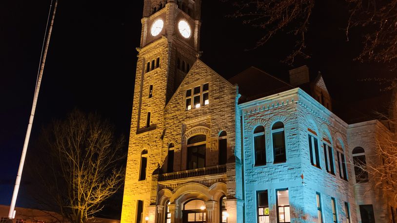 Greene County courthouse lit up in the blue and yellow of the Ukrainian flag, the latest local government to do so in support of the European country. LONDON BISHOP/STAFF