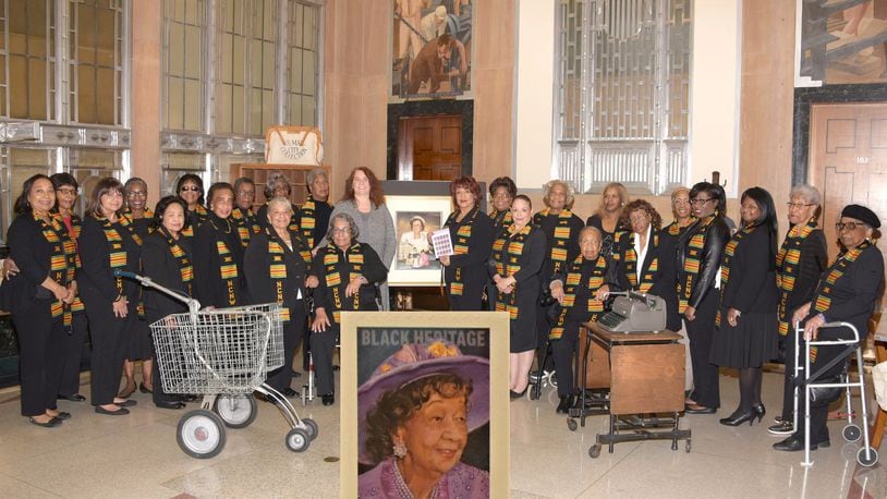 The Clark County/Springfield Section of the National Council of Negro Women commemorates the Dorothy Height stamp. To the left of the portrait of Dr. Height is Gillian Lewis, Postmaster of the U.S. Post Office, Springfield, and to the right is Deborah Woods, president of the section. CONTRIBUTED