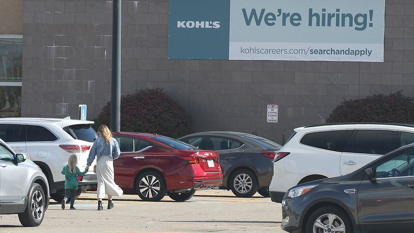A large sign on the front of Kohl's on North Bechtle Avenue letting people know they're hiring. BILL LACKEY/STAFF
