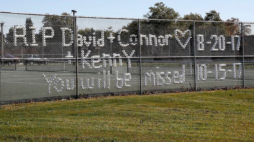 The fence around the tennis courts at Greenon High School has turned into a memorial for the three students who have been killed in two months. Bill Lackey/Staff