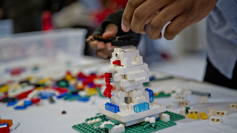 Rod Ferris builds a snowman sculpture using LEGOs during the LEGOLAND Discovery Center Atlanta's Brick Factor Competition at the Mandarin Oriental building in Atlanta on Sunday, November 23, 2014. Nine competitors were given an hour to build a sculpture with the theme of iconic holiday movies. Judges then crowned the victor with the title of Master LEGO Builder. There are seven Master Builders in the United States. JONATHAN PHILLIPS / SPECIAL