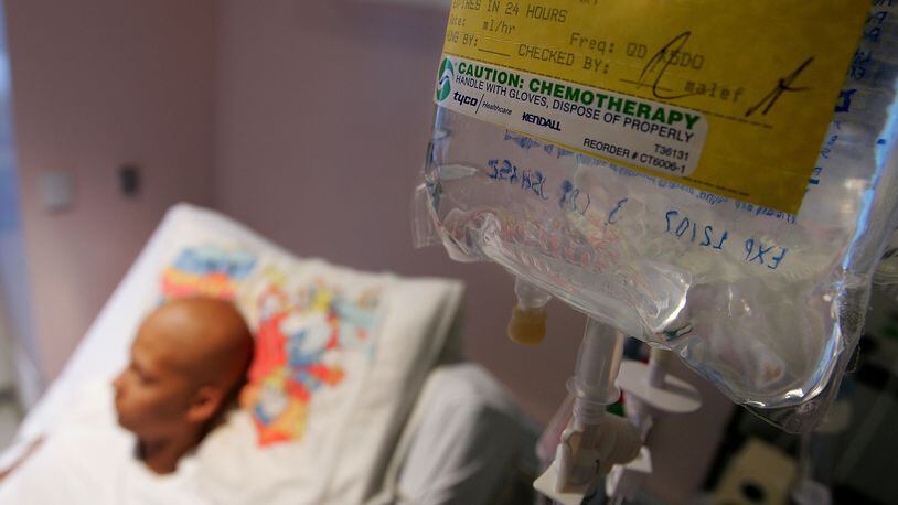 A cancer patient receives chemotherapy treatment, but for a family in the United Kingdom, chemo could not save their mother and father, who died just days apart, leaving three children behind.