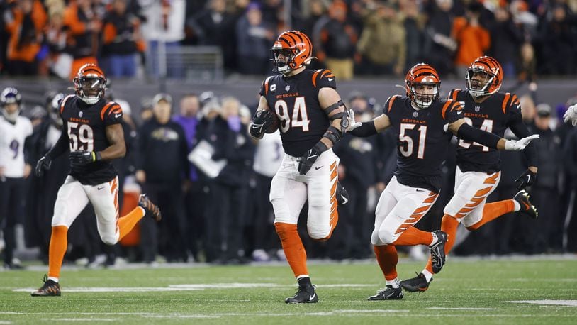 Bengals defensive lineman Sam Hubbard returns a fumble for a 98-yard touchdown against the Ravens at Paycor Stadium on Jan. 15, 2023. Nick Graham/STAFF