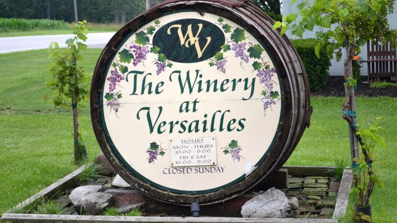 The wine-cask sign in front of the Winery at Versailles. Staff photo by Mark Fisher