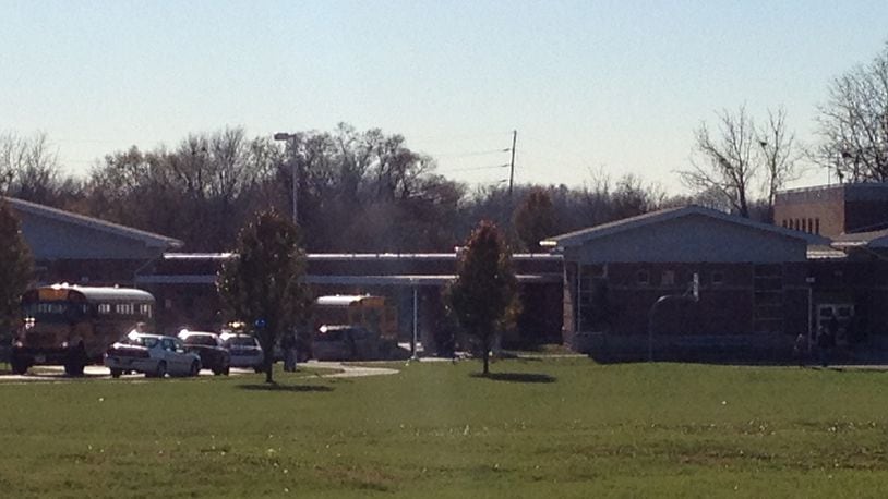 Kenwood Elementary in Springfield was placed on lockdown Thursday afternoon after a man brought an air pellet gun to the school building. That man and a man he passed the weapon to were arrested, police said.