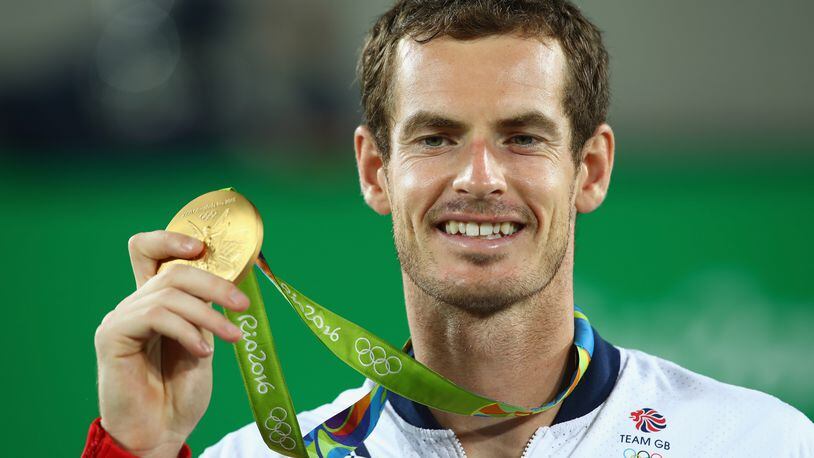 RIO DE JANEIRO, BRAZIL - AUGUST 14: Gold medalist Andy Murray of Great Britain poses on the podium during the medal ceremony for the men's singles on Day 9 of the Rio 2016 Olympic Games at the Olympic Tennis Centre on August 14, 2016 in Rio de Janeiro, Brazil. (Photo by Clive Brunskill/Getty Images)