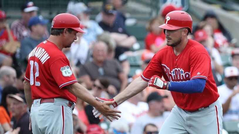 SARASOTA, FL - MARCH 13: Brock Stassi #78 of the Philadelphia Phillies celebrates with the third base coach Mickey Morandini #12 after hitting a solo home run in the third inning of the Spring Training game against the Baltimore Orioles on March 13, 2017 at Ed Smith Stadium in Sarasota, Florida. (Photo by Leon Halip/Getty Images)
