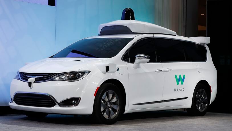 In this Jan. 8, 2017, file photo a Chrysler Pacifica hybrid outfitted with Waymo's suite of sensors and radar is displayed at the North American International Auto Show in Detroit. Right now, there is no car on sale that can drive itself without requiring the driver to pay attention to the road and be prepared to take control of the vehicle. In fact, some automakers have slowed down their timelines. (AP Photo/Paul Sancya, File)