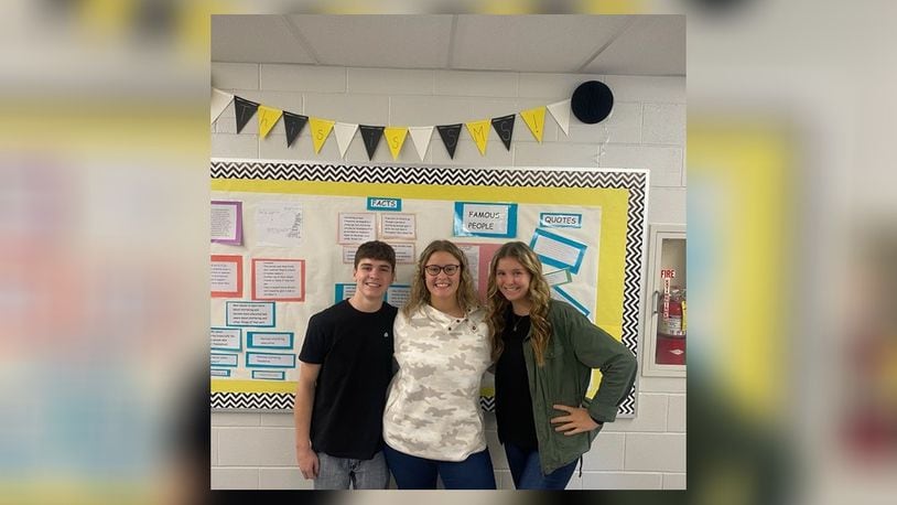 Gavin Wicks (Carah's friend), Carah Brown and Christa Brown (Carah's twin sister). Gavin and Christa helped Carah hang posters around the middle school, create a bulletin board, and organize the week. Contributed/Clark-Shawnee Local Schools