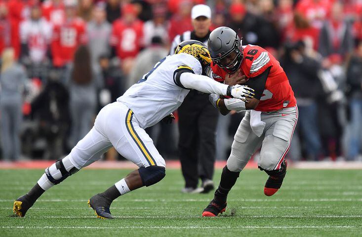 Ohio State holds off Michigan 30-27 in 2 OT