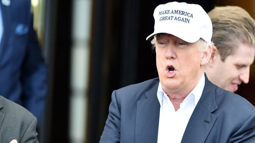 FILE PHOTO: President Donald Trump wears a Make America Great Again hat. A company is marketing a building set that features a Trump figure wearing the MAGA hat.