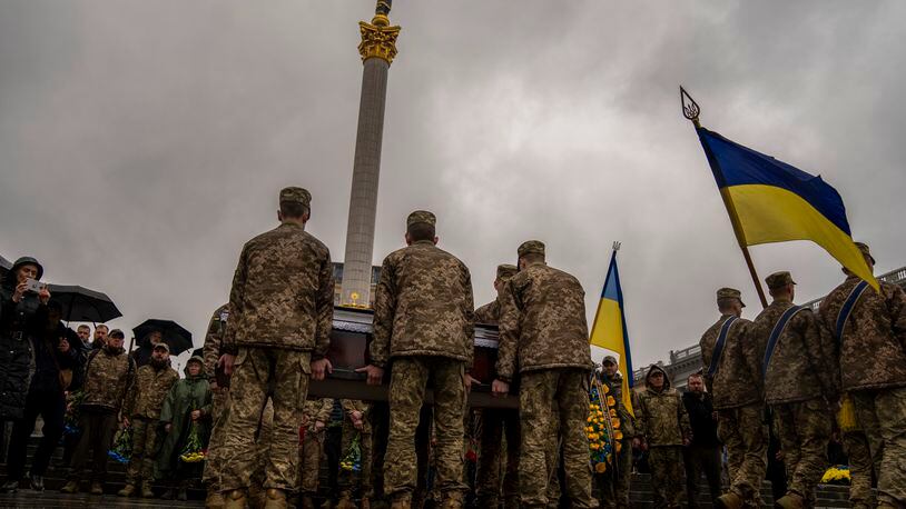Honour guards carry the coffin of Ukrainian army paramedic Nazarii Lavrovskyi, 31, killed in the war, during his funeral ceremony at Independence square in Kyiv, Wednesday, April 24, 2024. Lavrovskyi, who served in the 244th battalion of the 112th Separate Territorial Defense Brigade, was killed April 18 while helping to evacuate wounded troops from the frontline in the Kharkiv area of eastern Ukraine. (AP Photo/Francisco Seco)