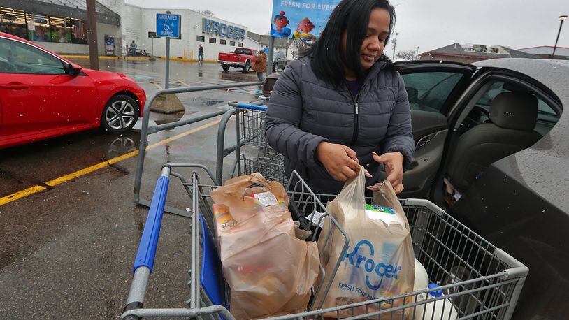 Meghan Davila says she's disappointed that the Kroger grocery store on South Limestone Street will be closing on March 4. Davila said she lives on the east side of Springfield but shops  at the Kroger on South Limestone because she likes it better. BILL LACKEY/STAFF