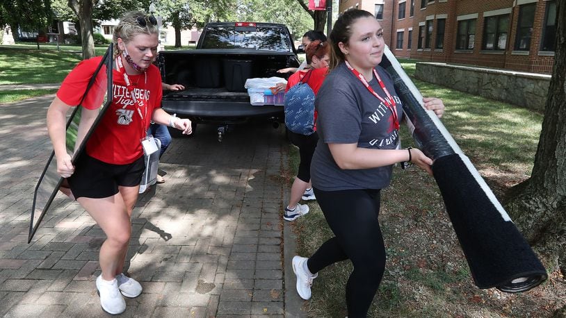 Wittenberg University has started disbursing over $2.2M in relief funds to students. Here, parents pulled their cars and trucks up to the dorm and upper classman helped freshman move their stuff into their rooms in August during Move-In Day at Wittenberg University. BILL LACKEY/STAFF