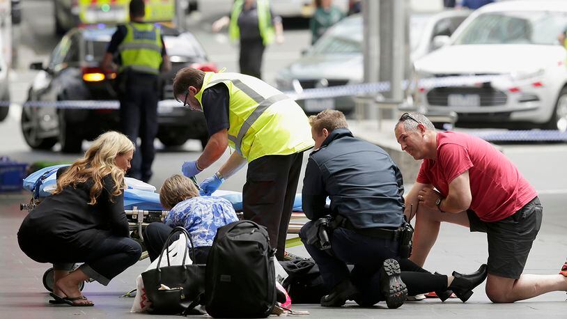 MELBOURNE, AUSTRALIA - JANUARY 20: Members of the public are given medical treatment on January 20, 2017 in Melbourne, Australia. Three people have been killed and 20 are injured after a man deliberately drove his car into pedestrians in Bourke Street Mall on Friday. (Photo by Darrian Traynor/Getty Images)