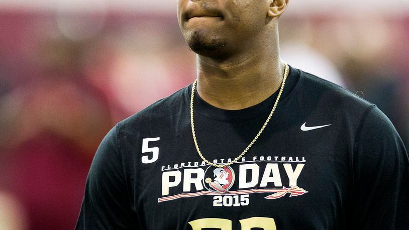 Jameis Winston walks between drills during Florida State football pro day in Tallahassee, Fla., Tuesday, March 31, 2015.