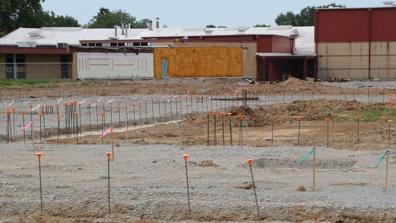 Construction continues on the new Greenon School located behind Indian Valley Middle School Friday. BILL LACKEY/STAFF