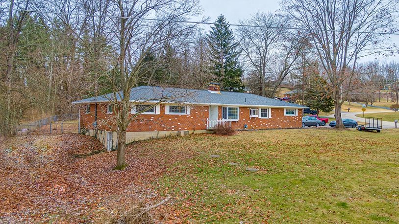 The all-brick ranch has about 2,270 sq. ft. of living space with 4 bedrooms and a possible fifth one. The home has 2 full kitchens and a partially finished, walk-out basement. CONTRIBUTED PHOTO