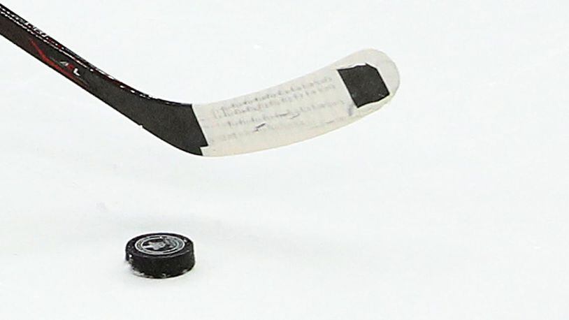 An 88-year-old Minnesota man finds hockey puck he lost as a teen more than 75 years later (photo illustration).
