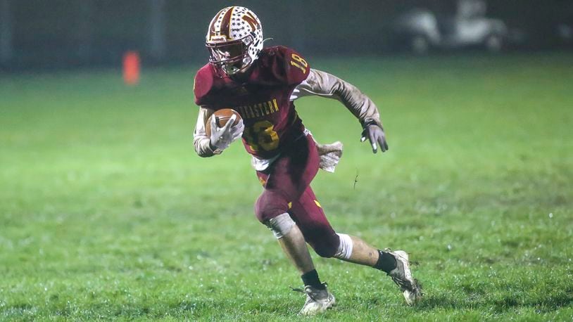Northeastern High School junior Dylan Haggy runs the ball after catching a pass during their game against Anna on Saturday night at Conover Field in Springfield. The Rockets won 17-3. CONTRIBUTED PHOTO BY MICHAEL COOPER
