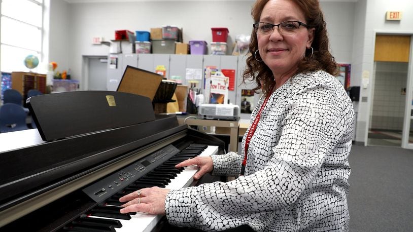 Sharon Safley, at the piano in the music room at Lincoln Elementary. BILL LACKEY/STAFF