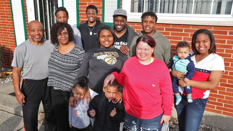 The Arnold family was profiled in a April 2019 story in the Springfield News-Sun. Destiny Wells is shown on the far right holding Sayon Smith Robertson. Others in the photo are standing in front, from left: Avalynn Jackson and Hayden Arnold. Behind them, from left: Willie and Vickie Arnold, Precious Wells, Mykayla Smith Robertson. Back row, from left: Brian Arnold, Tavione Arnold, Jason Arnold, DaeShawn Jackson. BILL LACKEY/STAFF