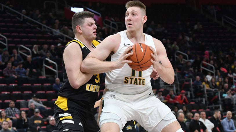 Wright State’s Loudon Love looks to score on Northern Kentucky’s Drew McDonald during the Horizon League tournament championship game. Keith Cole/CONTRIBUTED