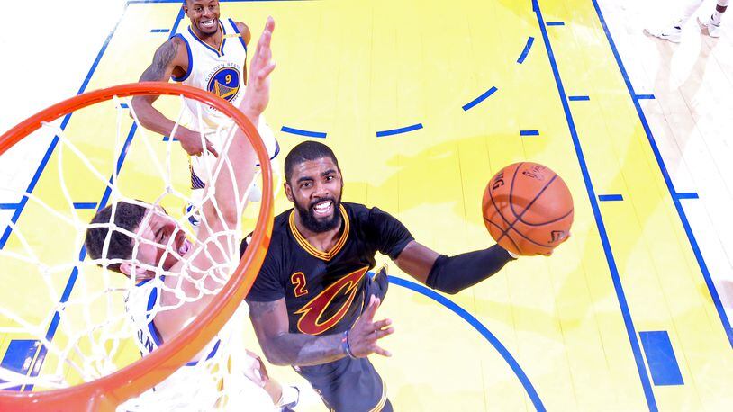 Kyrie Irving of the Cavaliers attempts a lay up against the Warriors during Game 5 of the 2017 NBA Finals at ORACLE Arena on June 12.