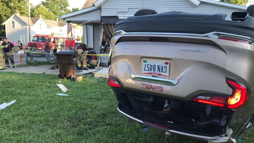 A car ended up on its top after the driver fled a traffic stop and crashed into a home at York and Kenton streets in Springfield on Thursday, June 28, 2018.