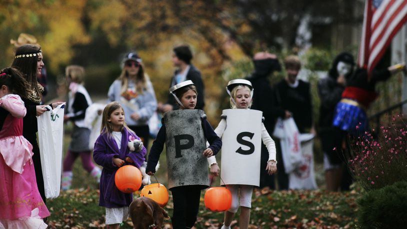 With trick-or-treaters expected to be out in smaller groups this year due to coronavirus, Ohio State Highway Patrol is reminding motorists and pedestrians to pay attention this Halloween. STAFF FILE PHOTO / JIM NOELKER