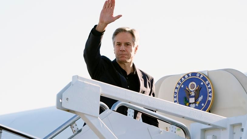 Secretary of State Antony Blinken waves as he boards a plane, Tuesday, April 23, 2024, at Andrews Air Force Base, Md., en route to China. (AP Photo/Mark Schiefelbein, Pool)