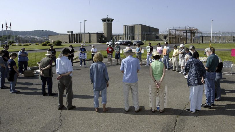 Death penalty opponents hold a vigil outside the Southern Ohio Correctional Facility at Lucasville, where Marvallous Keene was executed in 2009 for his role in Dayton's "Christmas killing" spree in 1992. DAYTON DAILY NEWS ARCHIVE