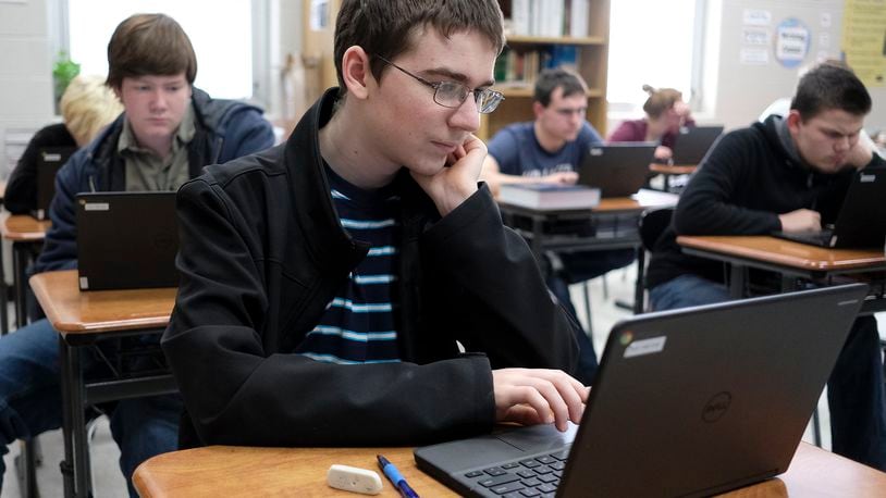 Tyler Wooten, a sophomore at Graham High School studies for an exam in his English class. Bill Lackey/Staff