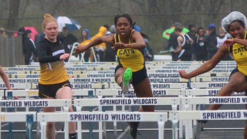 Springfield senior Tiffany Moss (middle), the defending Clark County 100-meter hurdles champion, set a personal best of 15.68 seconds in the hurdles at the Doug Adams Invitational in Xenia on Friday. Greg Billing / Contributed