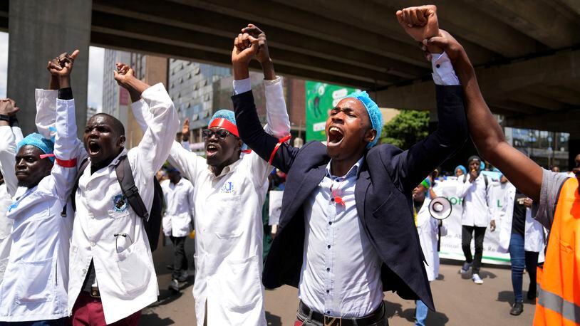 FILE - Doctors and other medical staff take part in a protest, in downtown Nairobi, Kenya, Tuesday, April 16, 2024. Kenya's public hospital doctors union on Wednesday, May 8, 2024, signed a return to work agreement with the government, ending a national strike that began in mid-March and had left patients in limbo. (AP Photo/Brian Inganga, File)