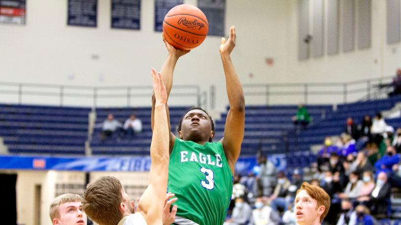Chaminade Julienne junior Justin Morah scores during the first half of the Eagles' victory over Ben Logan in a Division II sectional game at Trent Arena. Jeff Gilbert/CONTRIBUTED