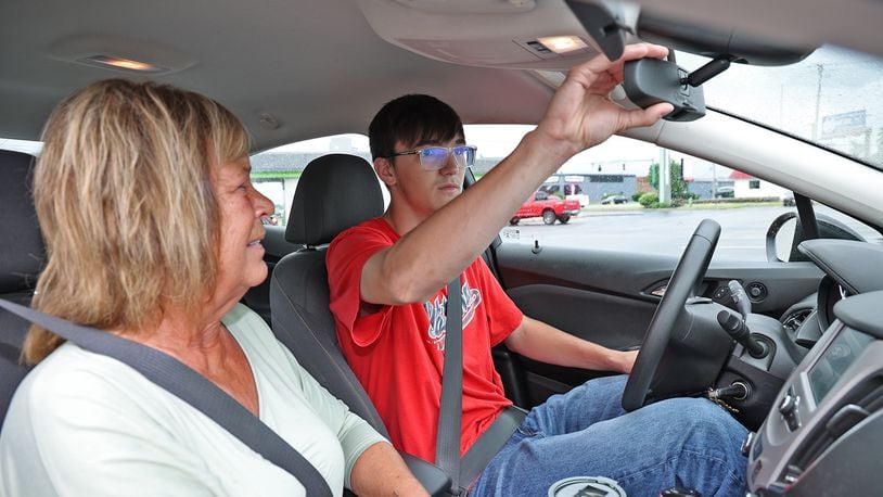 Driving instructor Linda Schetter, from the Springfield School of Driving,  gives Jacob Moore a driving lesson Wednesday. BILL LACKEY/STAFF
