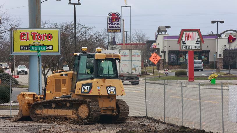 A bulldozer moves earth around at the site of the new City of Springfield Fire Station on South Limestone Street Friday, Jan. 20, 2023. BILL LACKEY/STAFF